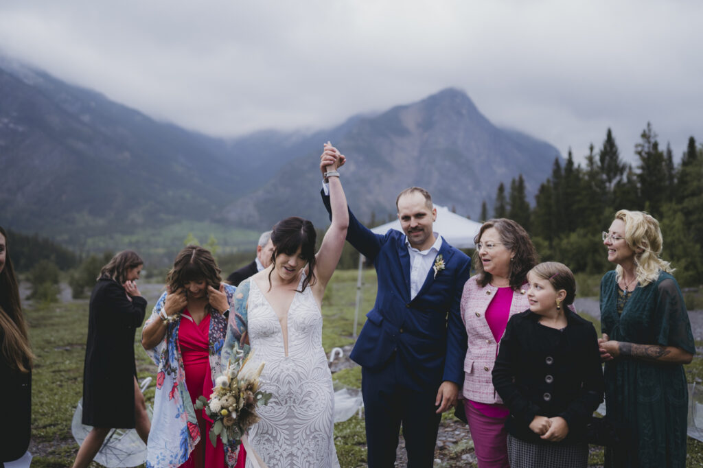 Bride and groom celebrating elopement with Canmore photographer