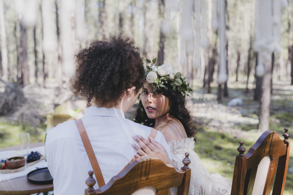 A boho bride and groom getting married in the forest.