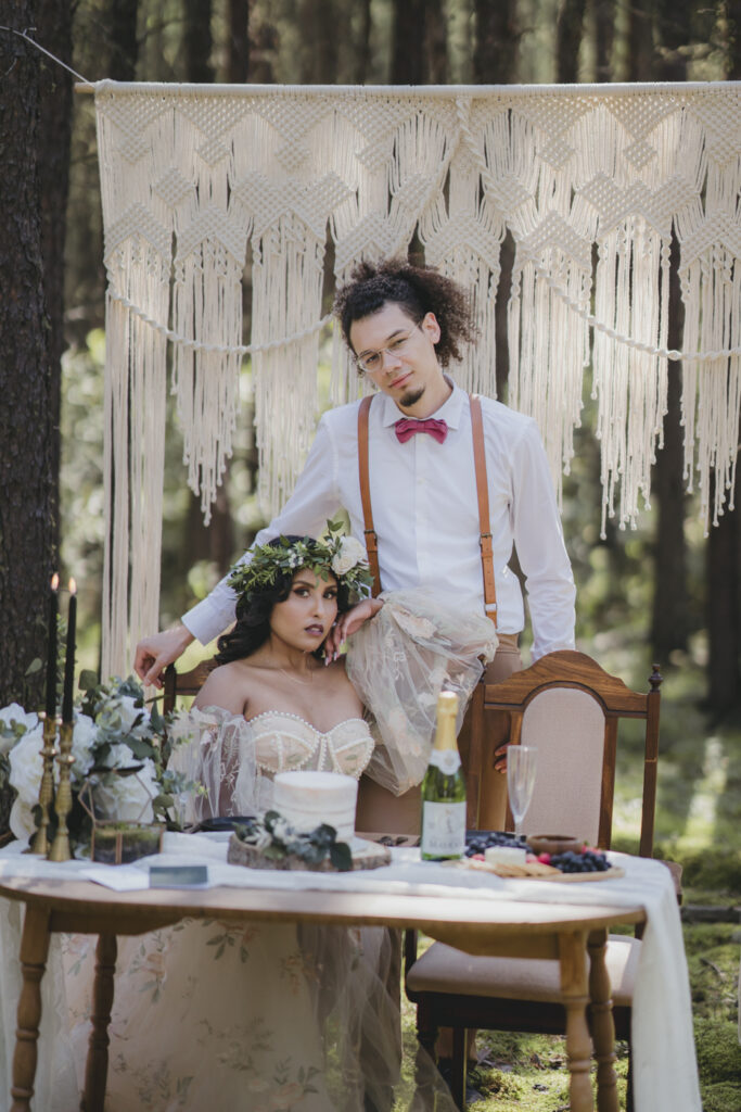 A boho bride and groom getting married in the forest.