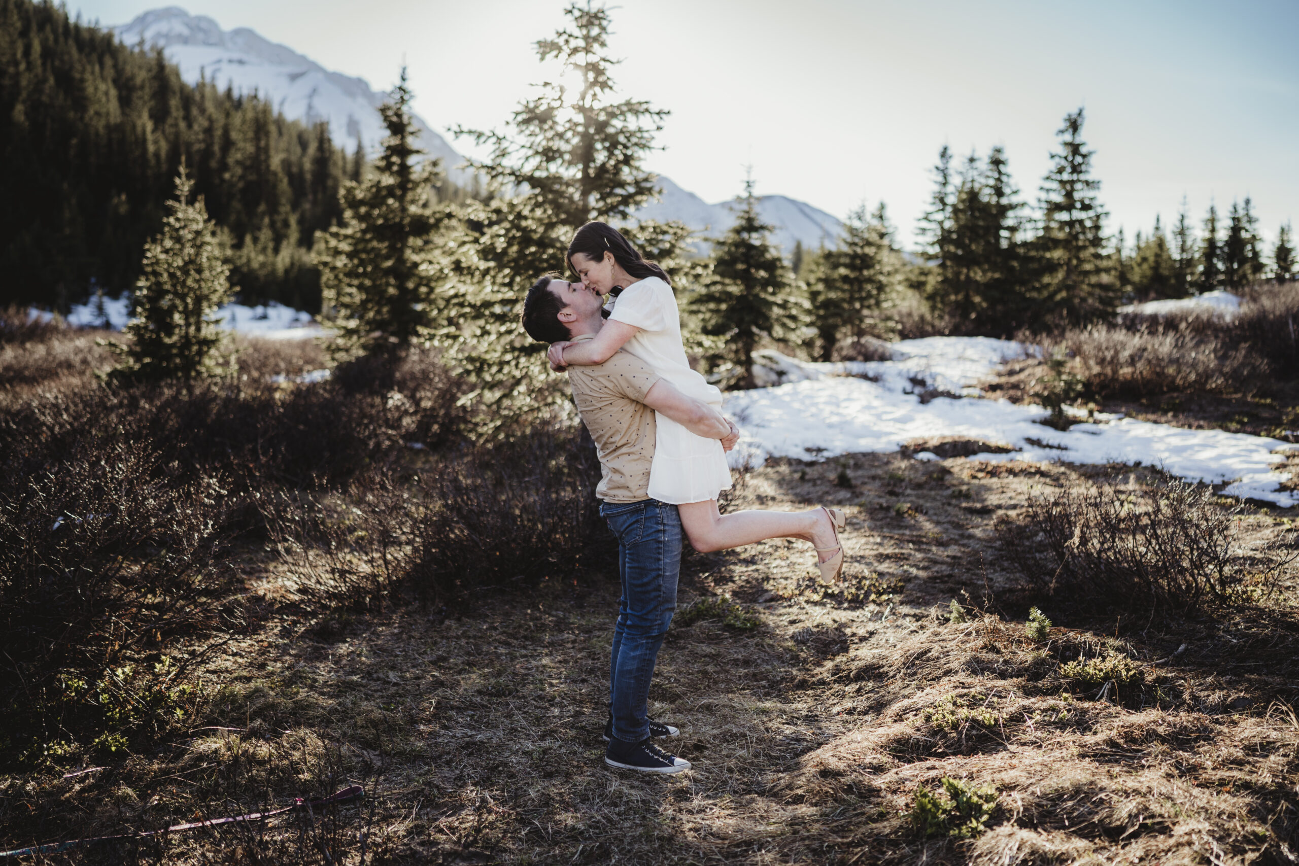 Couple embracing during their engagement session in the Canadian Rockies.