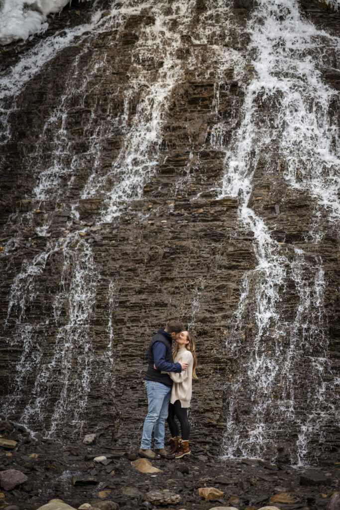 Couple kissing during their engagement session in a hidden gem location in Alberta. 